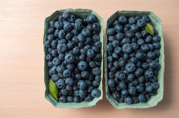 Fresh organic blueberry background. Texture blueberry berries close up. 
Concept of healthy and dieting eating