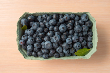 Fresh organic blueberry background. Texture blueberry berries close up. 
Concept of healthy and dieting eating