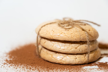 oatmeal cookies tied with a plait and sprinkled with chocolate, close-up.