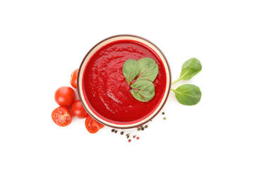 Tomato soup and ingredients isolated on white background
