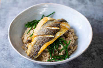 Mushroom risotto with samphire and pan fried sea bass