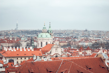 Fototapeta premium View of the roofs of the city. Urban landscape in Prague