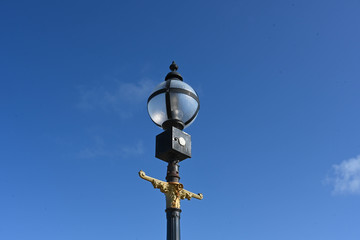 old street lamp on blue sky