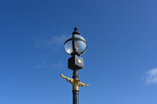 old street lamp on blue sky