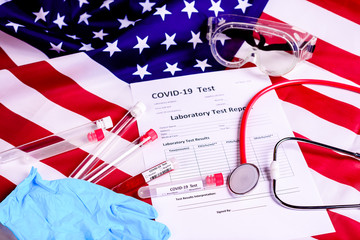 Naklejka premium Test tubes and protection material to perform a covid-19 test against the virus epidemic in the United States of America.