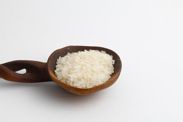 Pile lentil in wooden spoon isolated on white background. Top view.