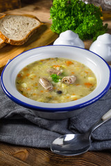 Polish barley soup with vegetables and chicken heart.