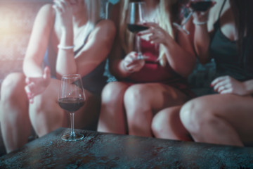 Young happy women spending time together, eating, drinking, talking. Friends at home.