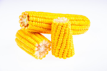 Ripe corn on the cob on a white background