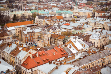 Fototapeta na wymiar Lviv old city vintage panorama with houses roofs top view, Lviv, Ukraine. Retro travel industrial photo background.