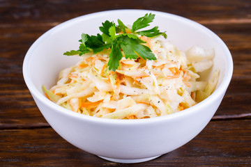 Salted cabbage sliced with black pepper and greens