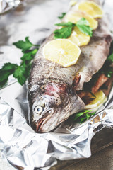 Raw rainbow trout in foil
