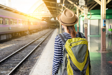 Traveler asian woman backpack in train station. Travel concept