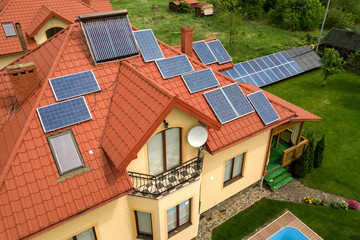 Aerial view of a new autonomous house with solar panels and wate