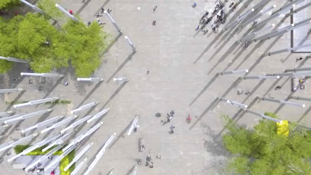 Medell&iacute;n, Antioquia / Colombia -  June 21 2019: Stunning Plaza de las Luces (Lights Plaza) Filled with High White Poles and People Walking, Skateboarding and Selling From the Sky