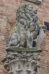 Stone lion on column in montepulciano