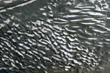 Beautiful background from a metal base, stainless metal of different shapes.
