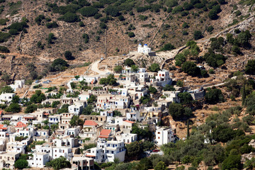 Fototapeta na wymiar Koronos, Naxos / Greece - August 25, 2014: A view of the mountain village of Koronos, Naxos, Cyclades Islands, Greece