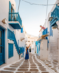 couple on vacation Mykonos Greece, Little Venice Mykonos Greece, sunset at ocean fron at Mykonos...