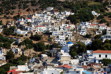 Koronos, Naxos / Greece - August 25, 2014: A view of the mountain village of Koronos, Naxos, Cyclades Islands, Greece - obrazy, fototapety, plakaty