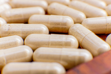 capsule drugs to fight viruses that are isolated against a white background and copy space, macro