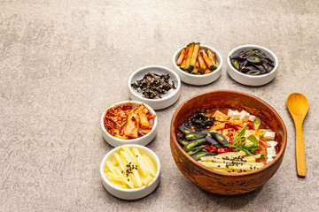 Traditional Korean spicy soup with kimchi, tofu, vegetables. Hot dish for healthy meal