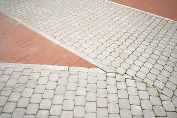 Fototapeta premium stone pavement in perspective with nobody. old streets.