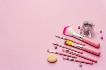 Makeup cosmetic set on pink background