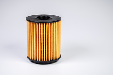 Replaceable cartridge fuel system. New fuel filter element on a gray gradient background