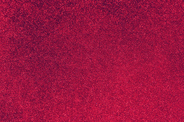 Color of the year 2023: Viva Magenta. Glitter twinkle abstract Christmas holiday background with sparkles. Fashionable pantone color. Modern luxury mock up with sequins