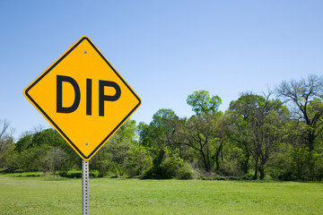 DIP Sign With Blue Sky, Green Trees and Grass
