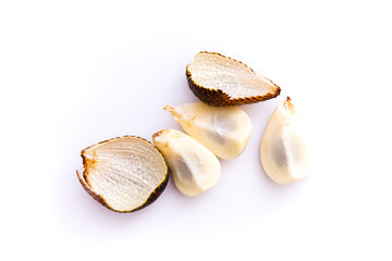 salacca or thorny palm fruit that has been peeled and intact, isolated white background and copy space, scientific name: Salacca zalacca