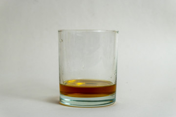 glass of whiskey with ice on black background