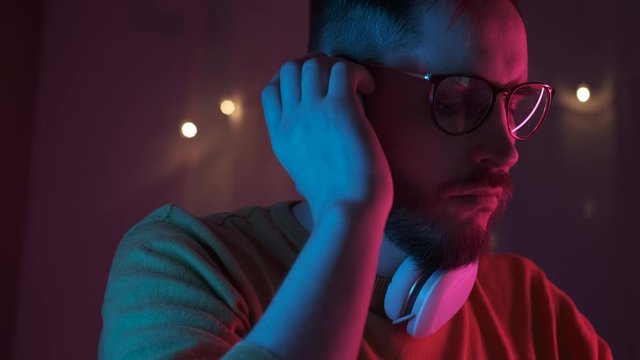 Close up portrait handsome man DJ playing music at home recording studio workshop. Creative atmosphere new music. Student learns to write music. Online education and training. Sound beat maker