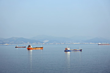 Bunkering of a ship on the open roadstead of the port of Nakhodka, Russia.