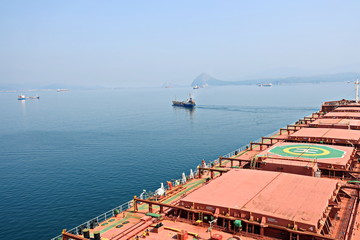 Bunkering of a ship on the open roadstead of the port of Nakhodka, Russia.