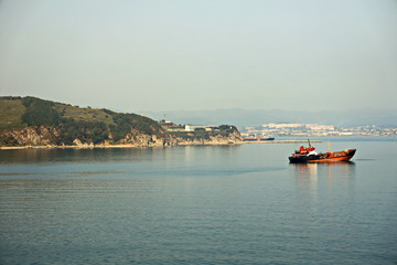Bunkering of a ship on the open roadstead of the port of Nakhodka, Russia.