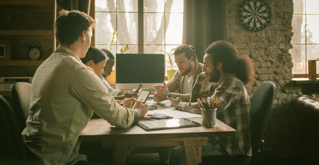 Mobile Meeting Of Diverse Group Creative People In Loft Office, Group Of Young Freelancers Chatting On Their Phones At The Same Time Together, Successful Hipster Team In Coworking Space, Side View