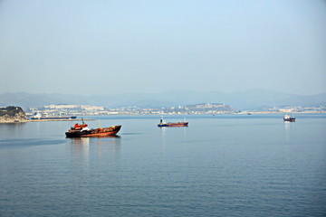 Bunkering of a ship on the open roadstead of the port of Nakhodka, Russia.