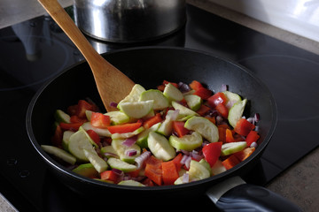 Raw vegetables cooked on a pan
