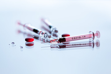 Syringes and tablets on white background, Covid-19 corona virus vaccine and medicine