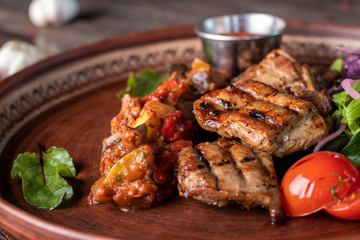 Turkey skewers, vegetable salsa and barbecue sauce, restaurant dish, Closeup, Horizontal orientation