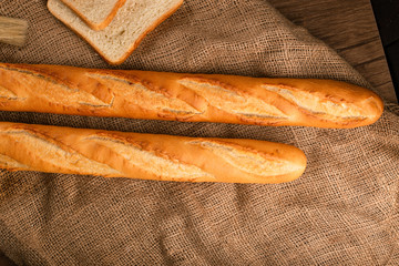 Two tasty french baguettes on tablecloth