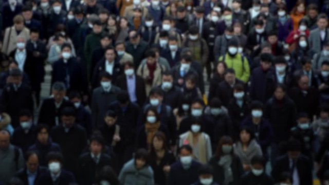 4K Blurred defocused view of People locals and tourists wearing protective mask against transmissible infectious diseases and as protection the flu in public transport. Coronavirus 2019-nCoV-Dan