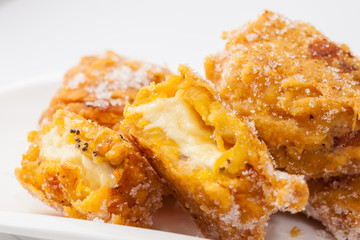 Typical Colombian aborrajados served on a white dish