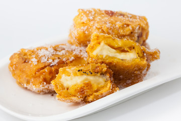 Typical Colombian aborrajados served on a white dish