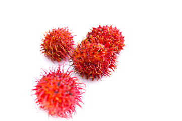 ripe red rambutan fruit, isolated white background and copyspace, scientific name: Nephelium lappaceum