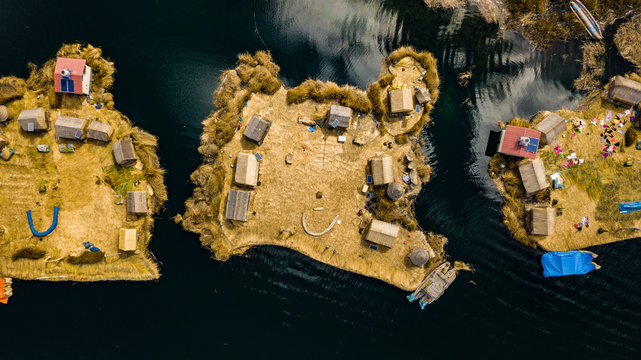 Aerial photo of floating islands on Lake Titicaca in Peru - a habitant of indigenous community Uros who are living on floating self-made islands made of totora plant 