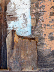 rough weathered brown and blue wood pieces close up, textured background