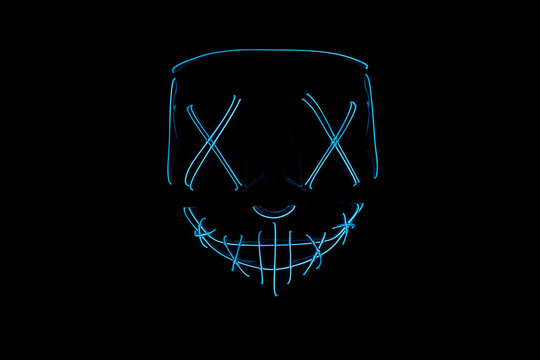 Neon blue glow mask in the dark